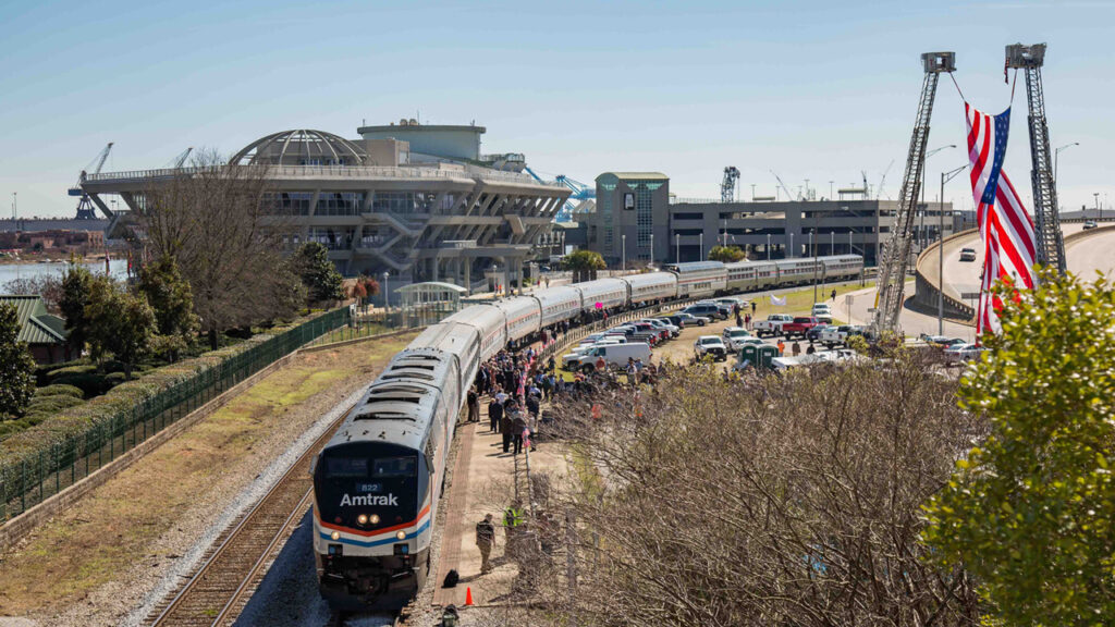 The inspection train arrives in Mobile, greeted by a crowd lined up by the tracks